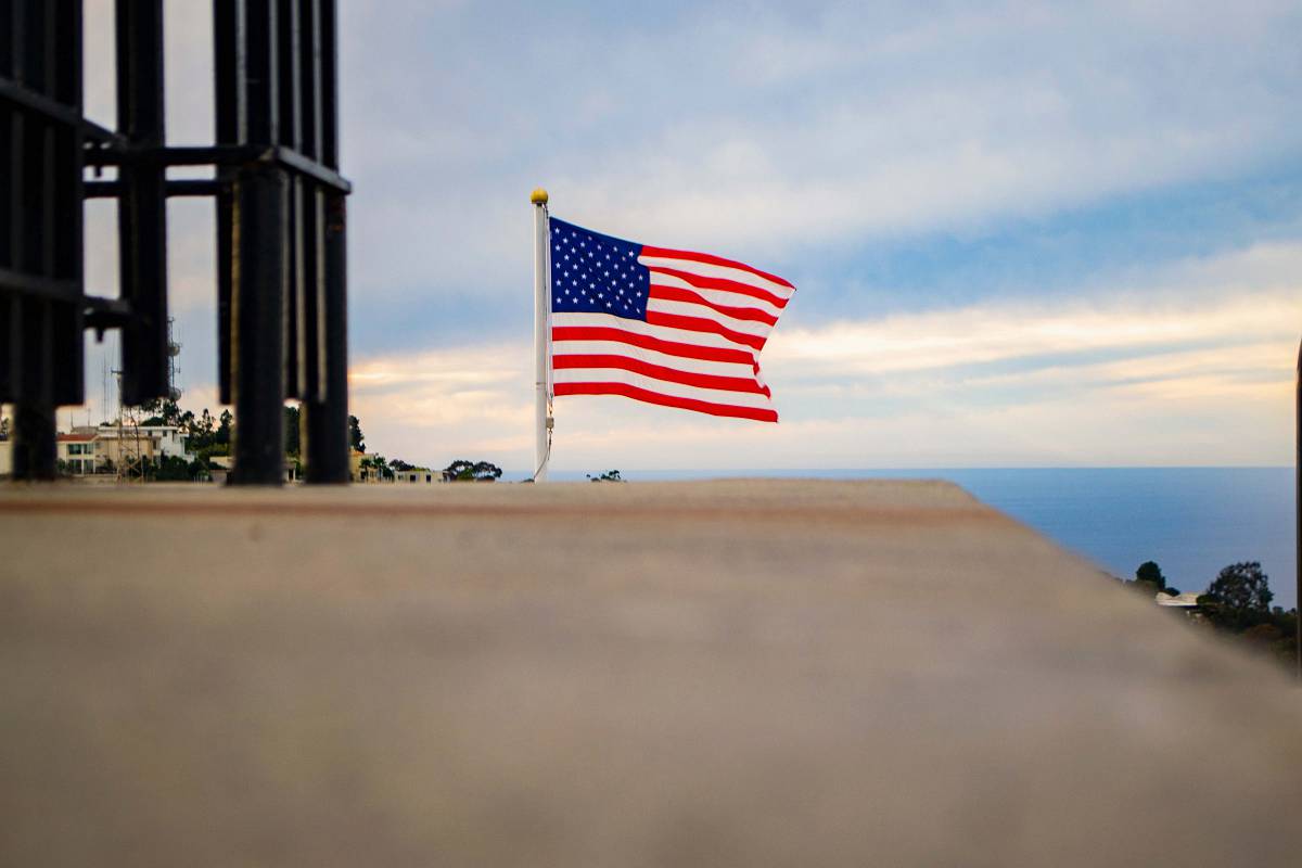 san diego us a flag on brown wooden fence ca